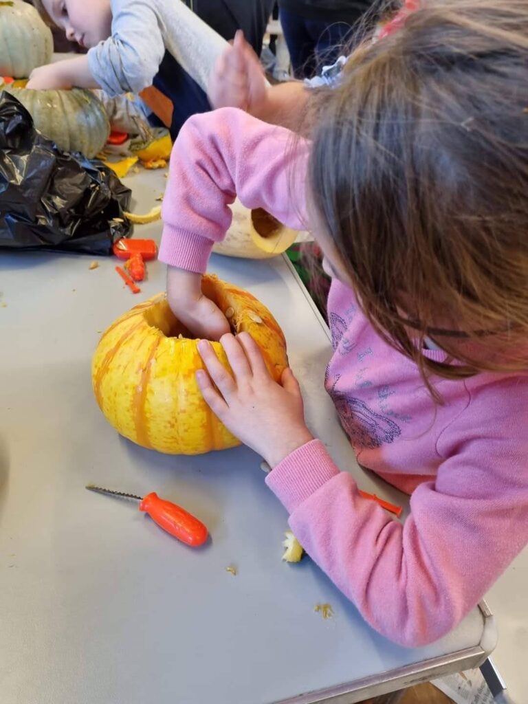 Beavers carving Halloween pumpkins